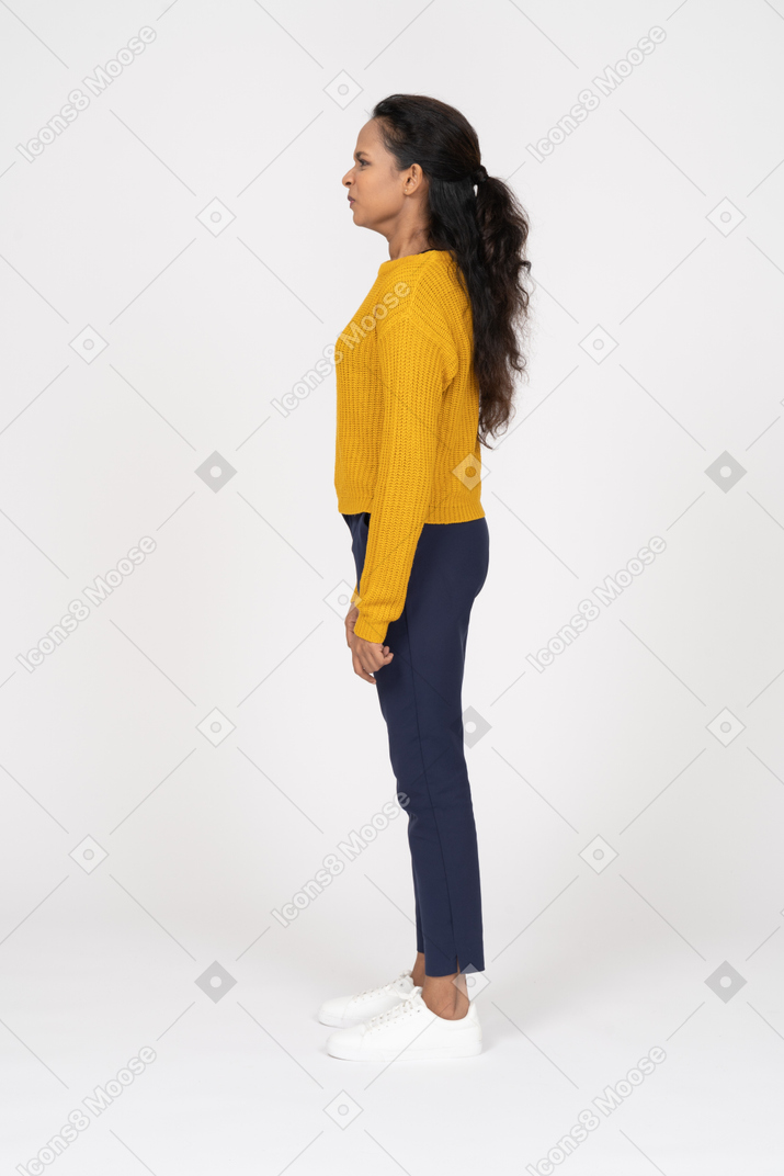 Side view of an upset girl in casual clothes