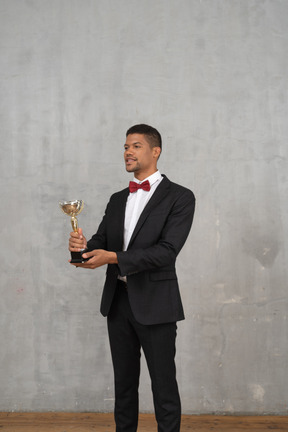 Man in a suit presenting an award