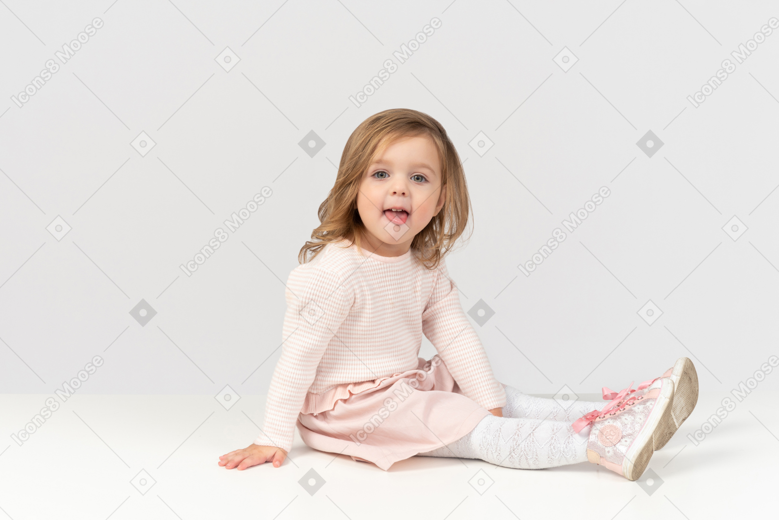 Cute little girl showing a tongue