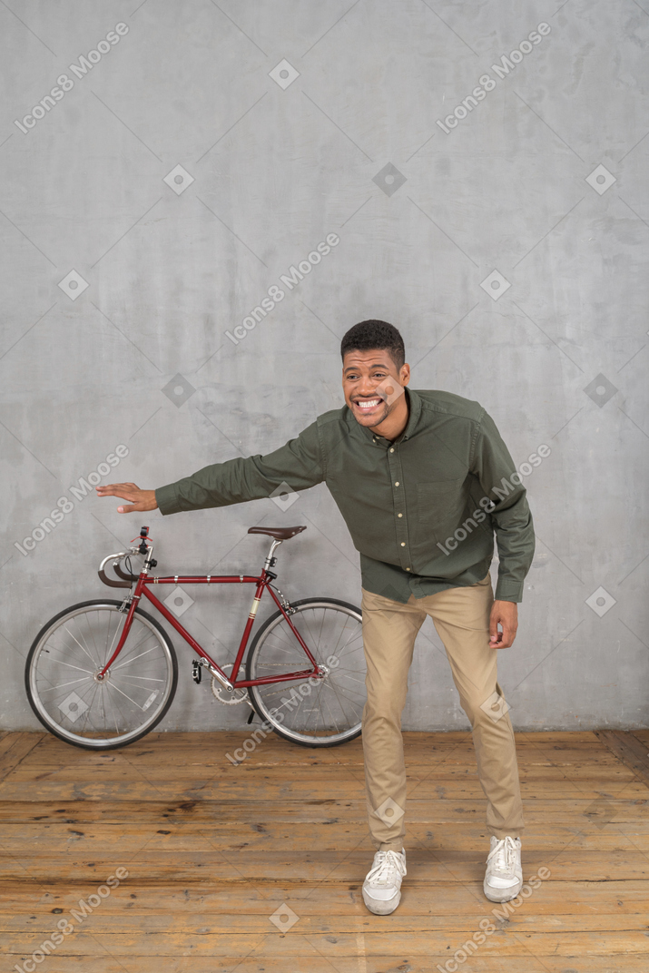 Smiling man leaning forward while asking for a ride