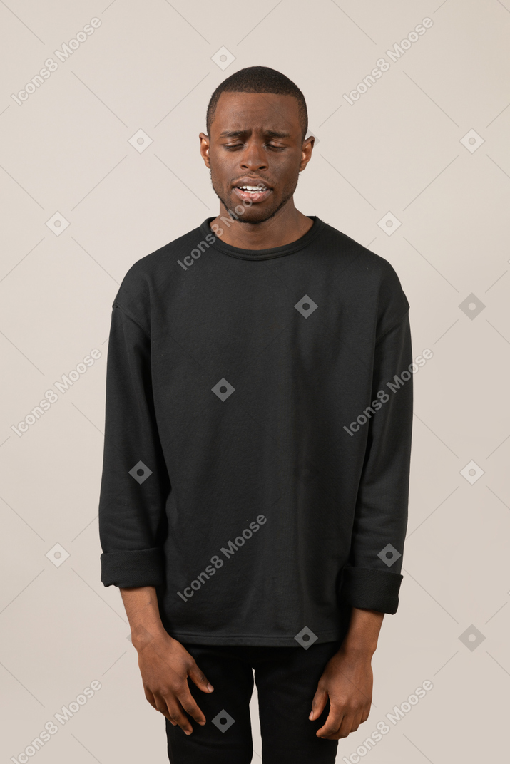 Depressed young man looking down
