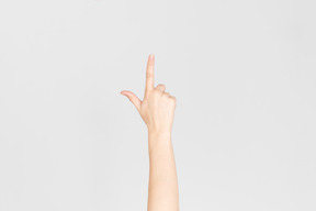 Female hand pointing up