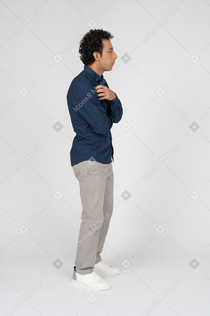 Man in casual clothes posing in profile