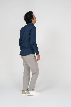 Man in casual clothes standing in profile