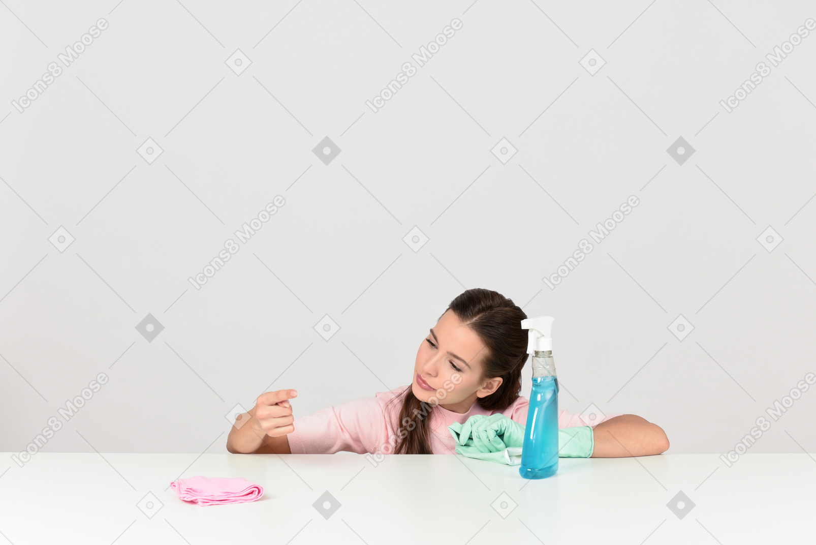 Attractive young woman dusting a surface