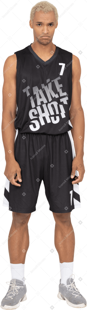 Front view of a sad young male basketball player standing still
