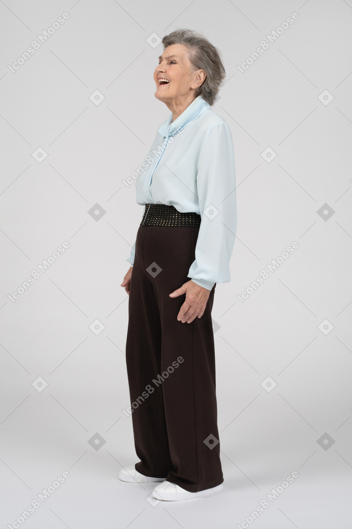 Side view of an old woman smiling excitedly