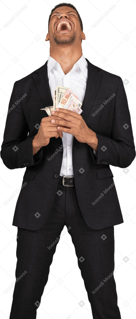Front view of a young man in black suit holding banknotes