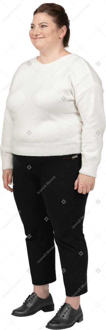 Happy plump woman in casual clothes standing