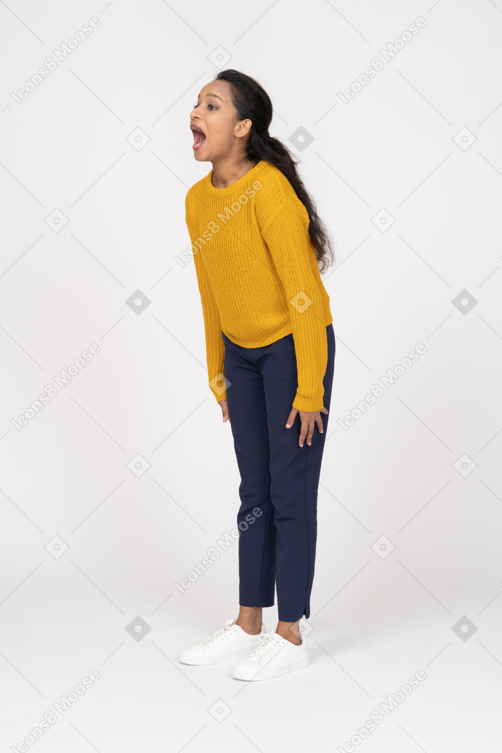 Side view of a girl in casual clothes shouting