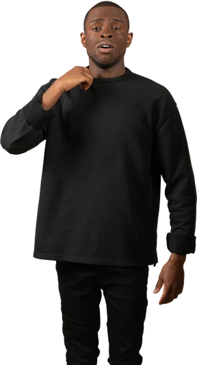 Young man pulling his crewneck