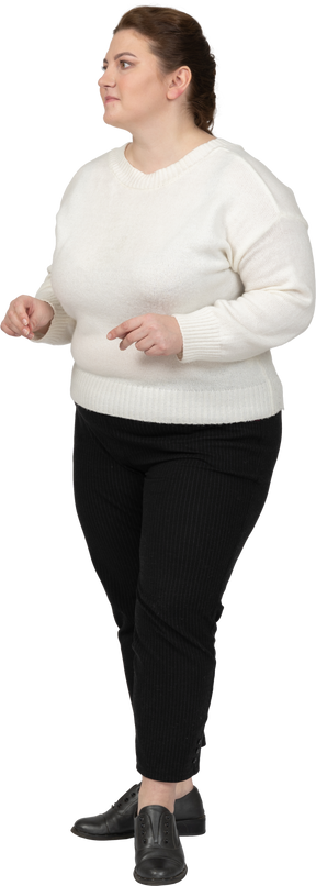 Plus size woman in casual clothes standing
