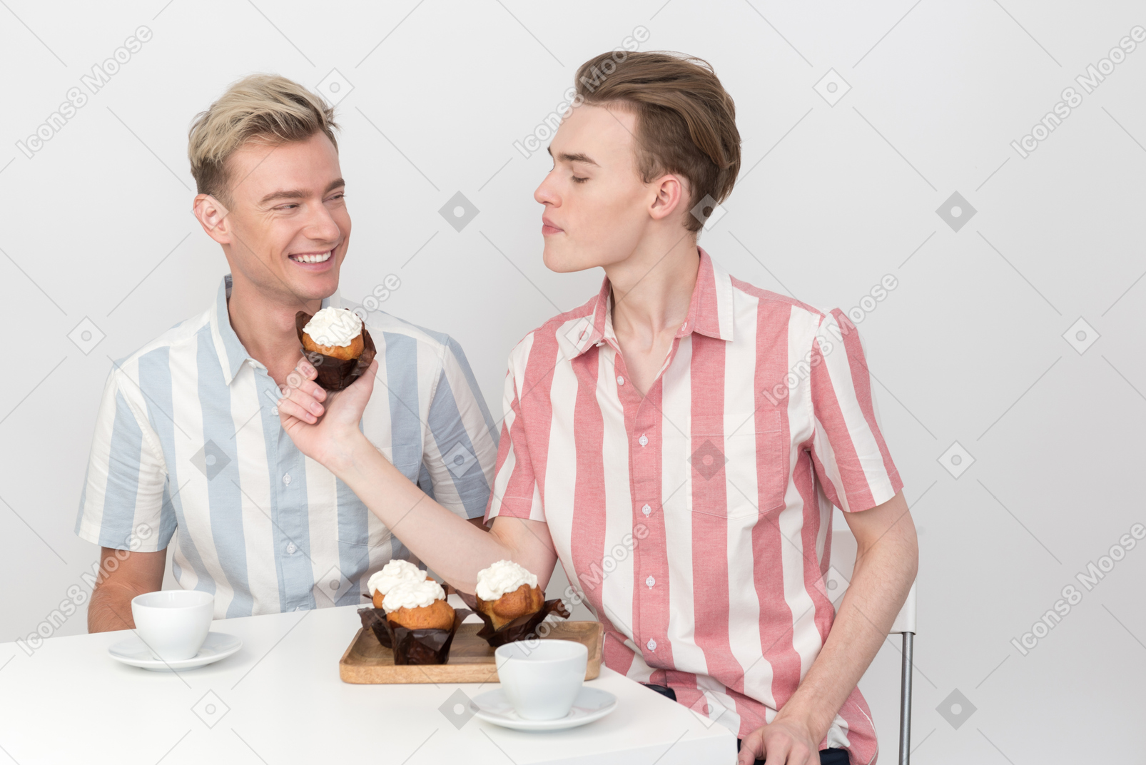 Guy proposing his partner to eat a cupcake