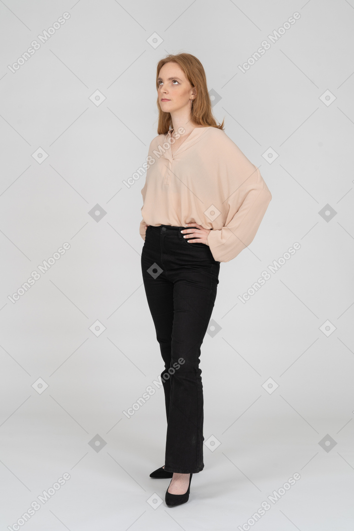 Woman in beautiful blouse standing