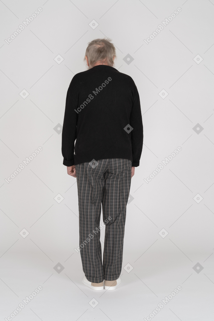 Old man standing back to camera