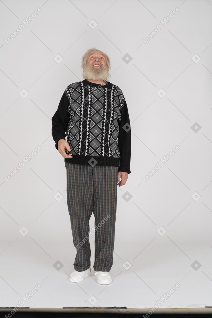 Old man talking and looking up with raised hand
