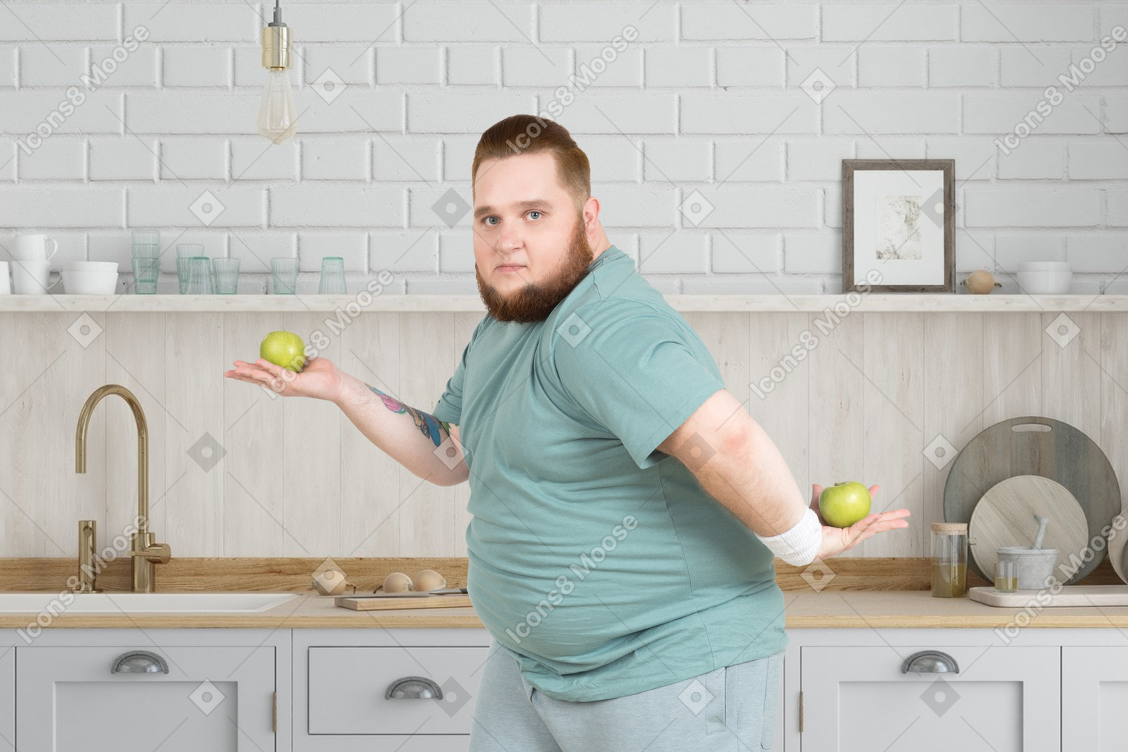 A fat man holding two apples in the kitchen