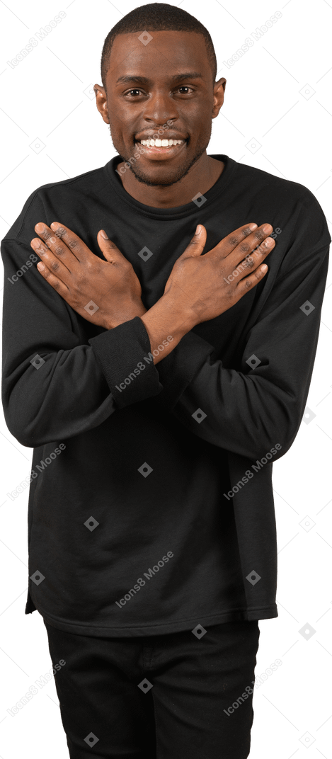 Positive young man with hands crossed on chest