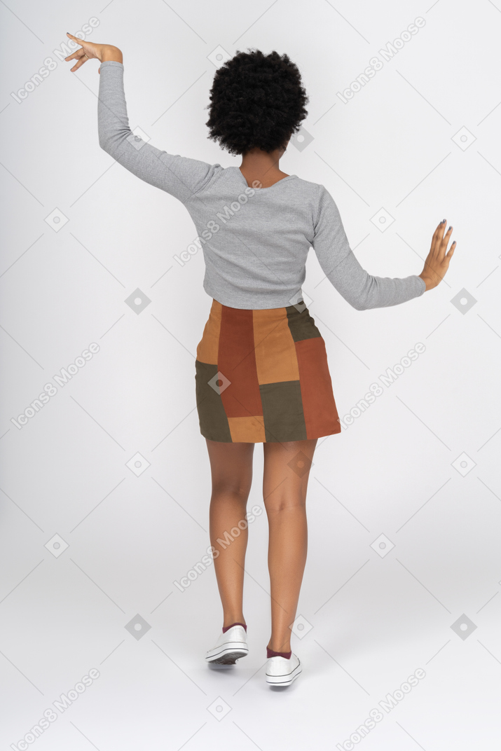 African girl dancing back to camera
