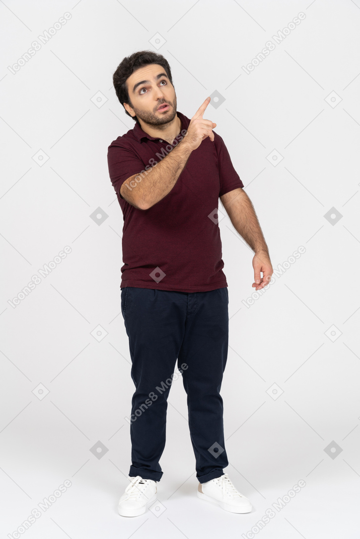 Man in casual clothes pointing up