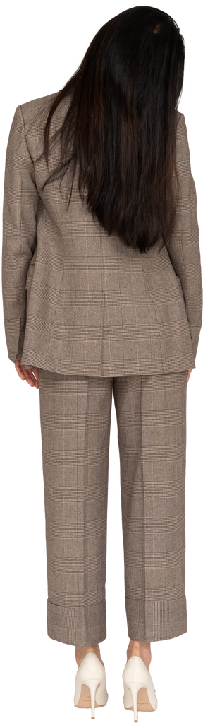 Back view of a young lady in brown business suit tilting head