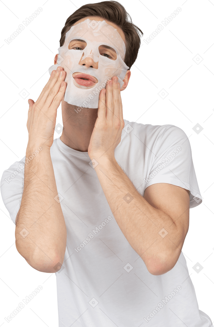 Front view of a young man posing in facial mask