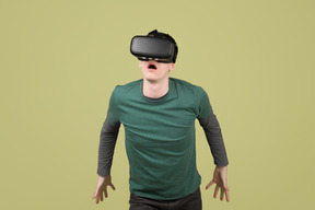 Astonished man in virtual reality headset