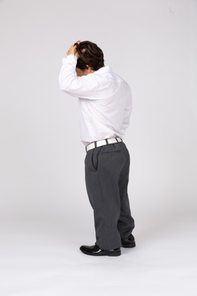 Young man fixing hair