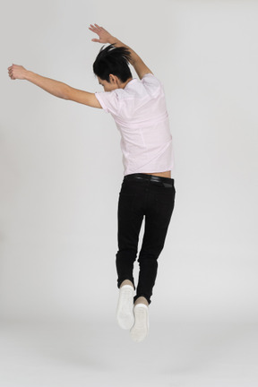 Man in casual clothes jumping