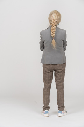 Back view of an old lady in suit