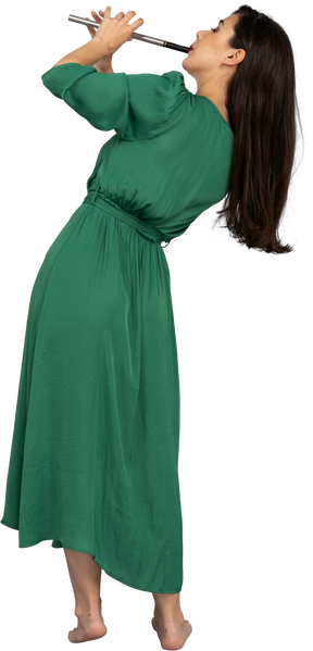 Back view of a young lady in green dress playing flute while leaning aside