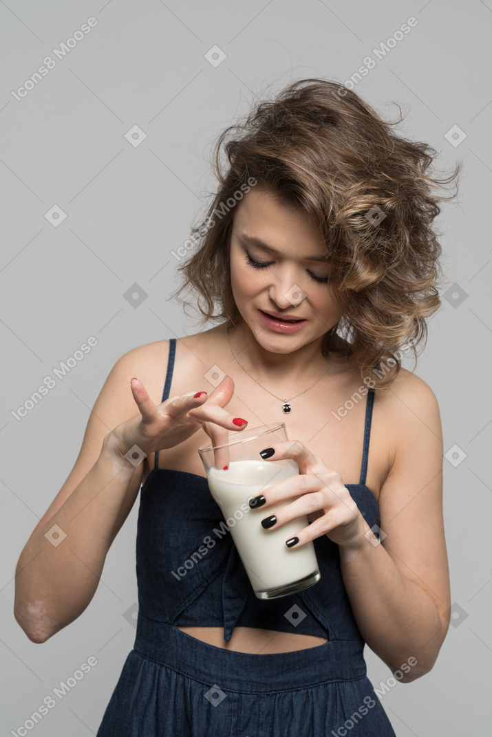 Cute girl with a glass of milk