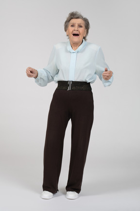 Front view of a shocked old woman