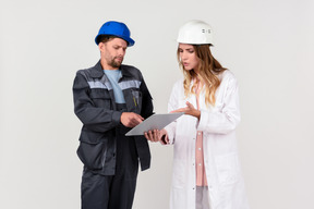 Female and male engineer colleagues discussing some work stuff