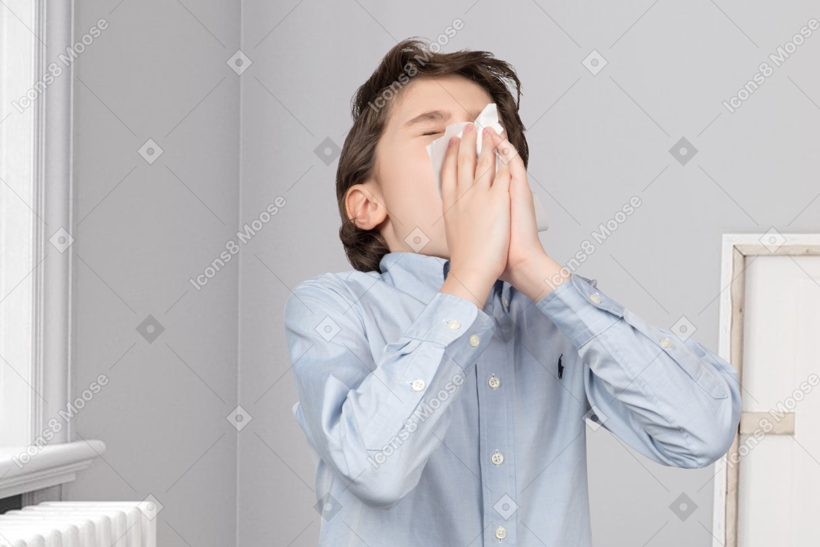 Little boy sneezing