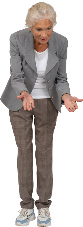 Front view of an impressed old woman in suit bending down