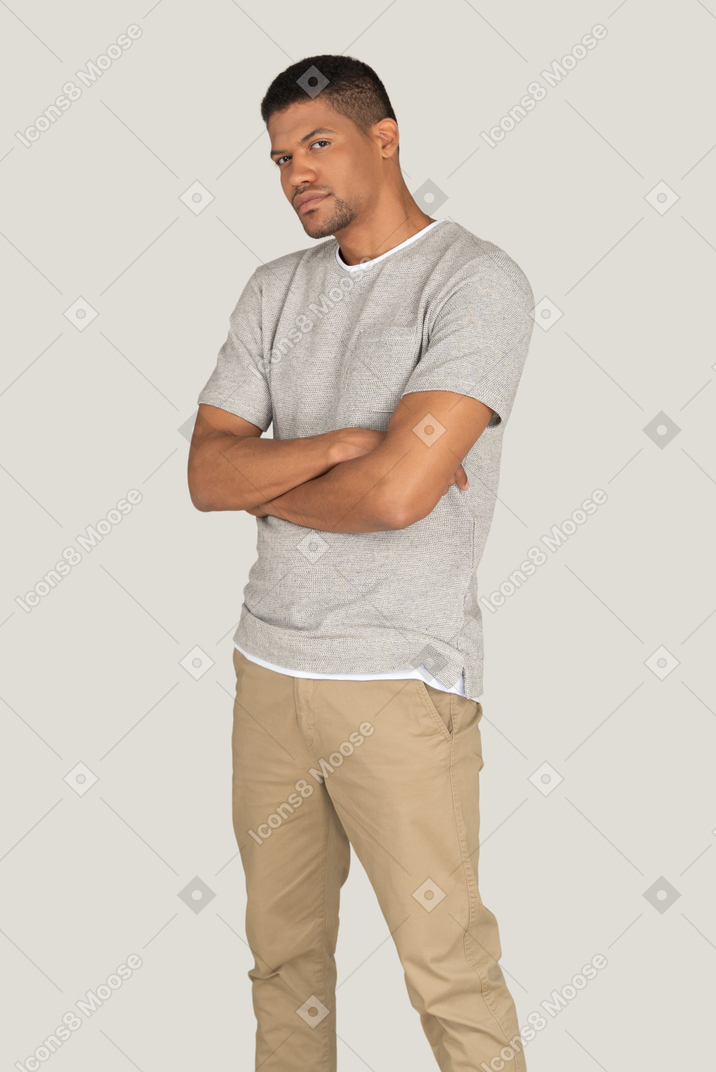 Athletic young man posing on the yellow background