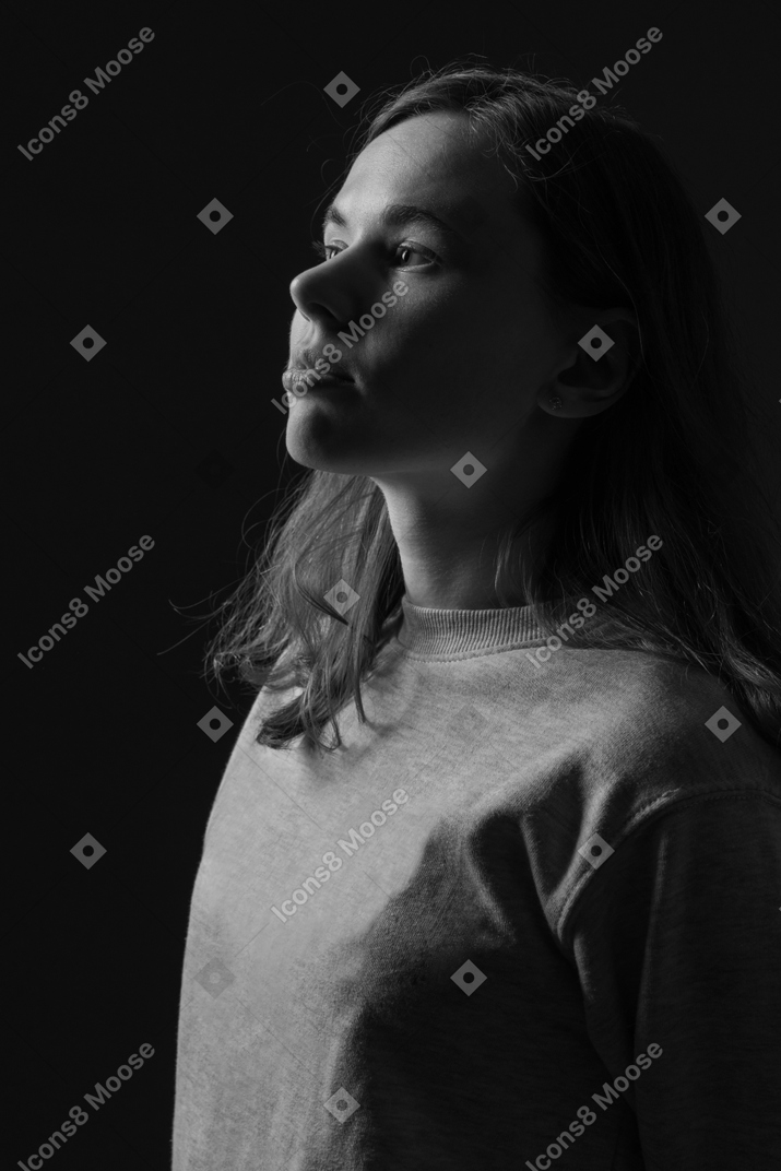 A woman in silhouette against a black background