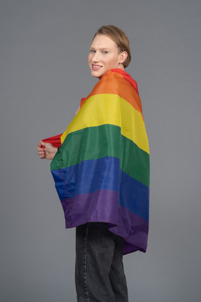 Person wrapped in a pride flag