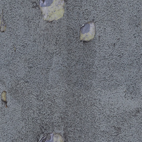 Stone surface covered with gray plaster layer