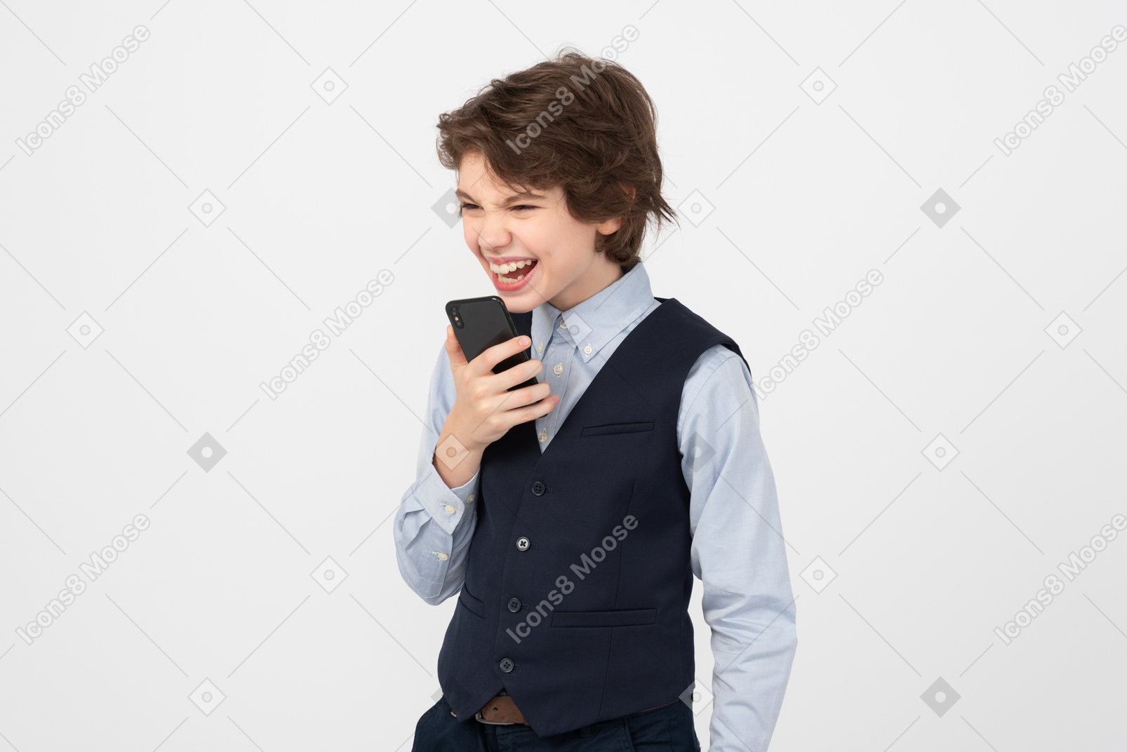 Angry schoolboy using his smartphone