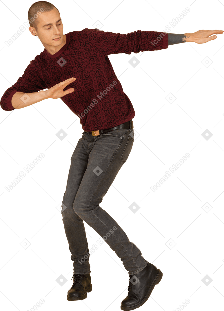 Front view of a dancing young man in red pullover