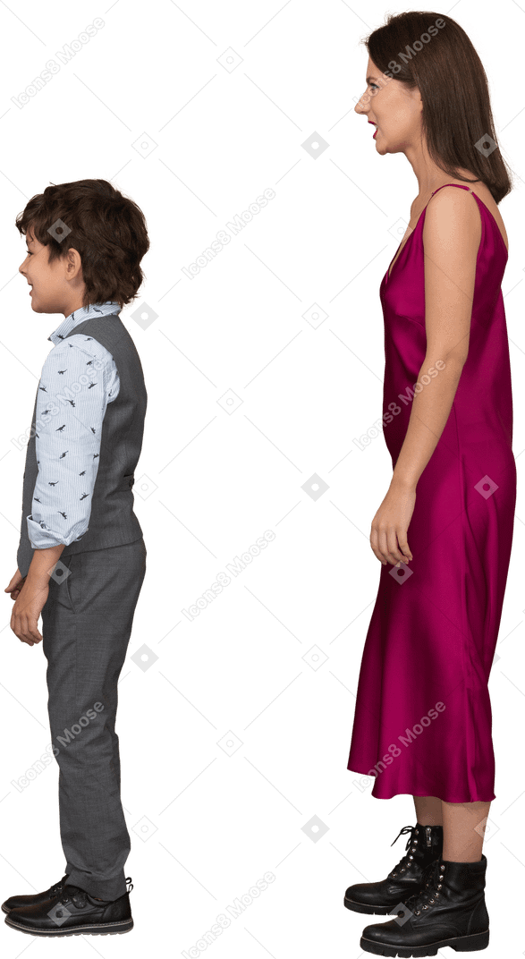 Boy and woman standing still in profile