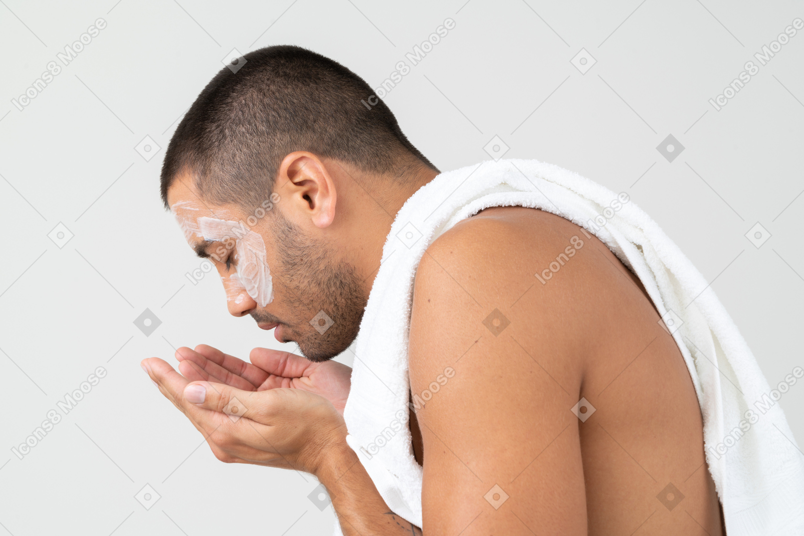 A man washing off face mask