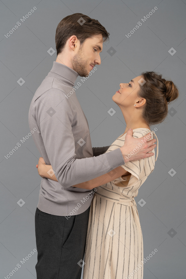 Young couple with their arms around each other