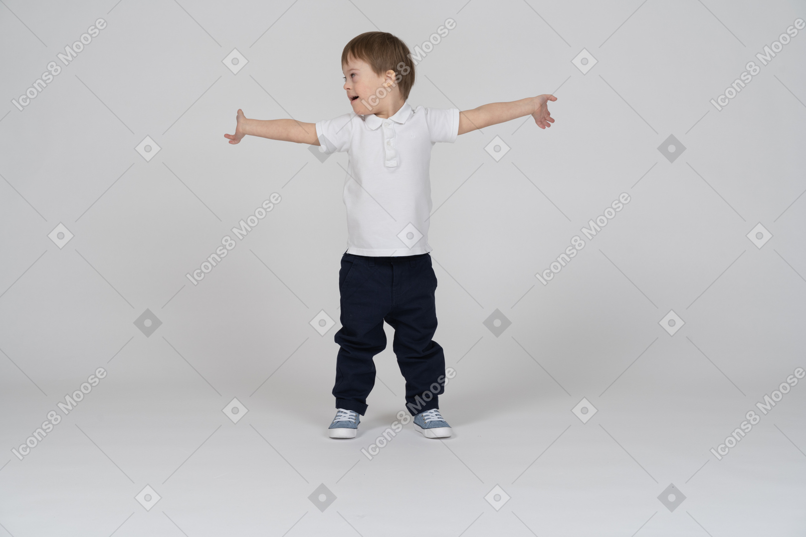 Front view of a boy standing with his arms wide open