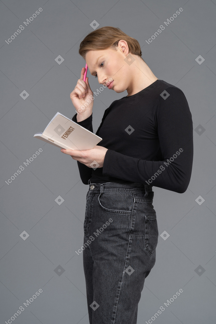 Side view of a person thinking about what to write