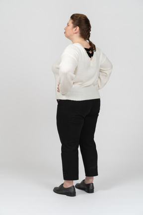 Plump woman in casual clothes standing