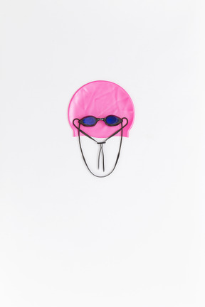 Funny face made of swimming accessories