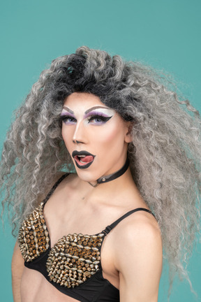 Portrait of a drag queen licking their lips